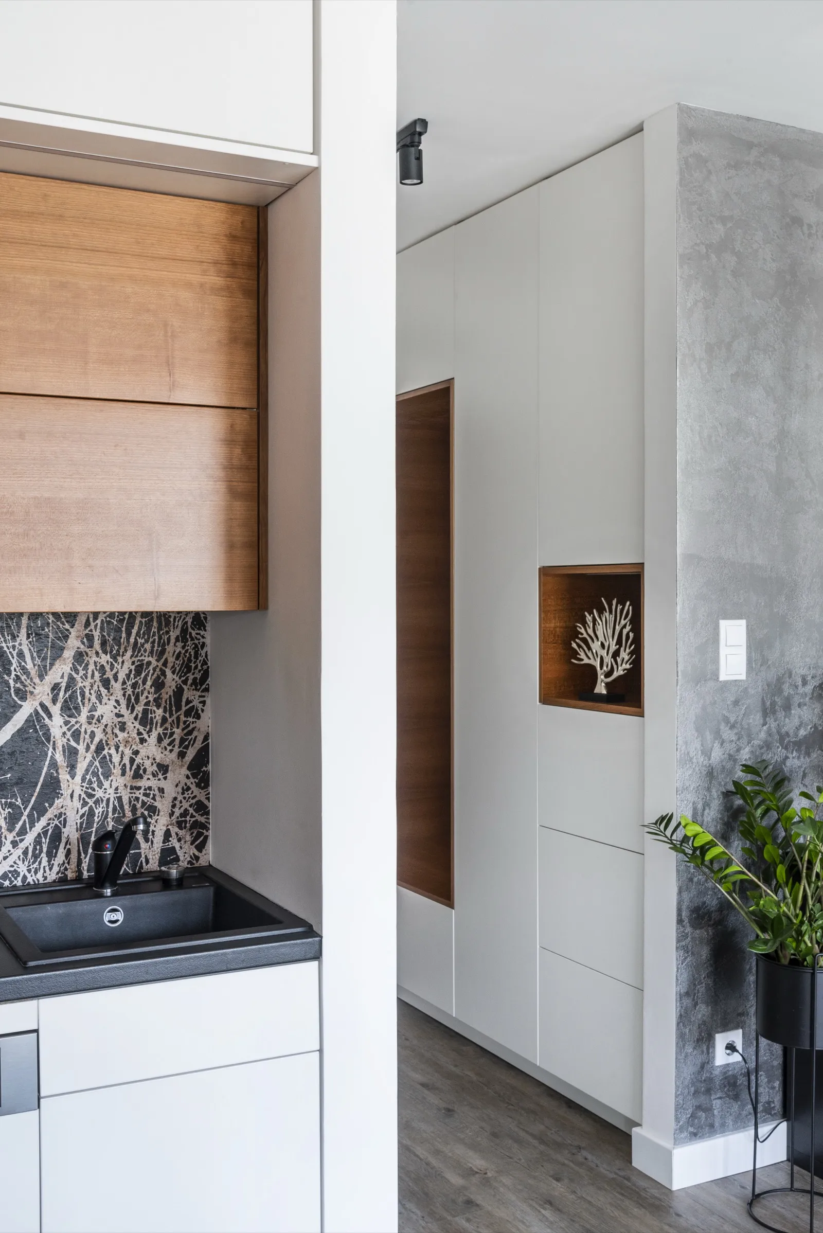 Kitchen with black-and-white forest wallpaper