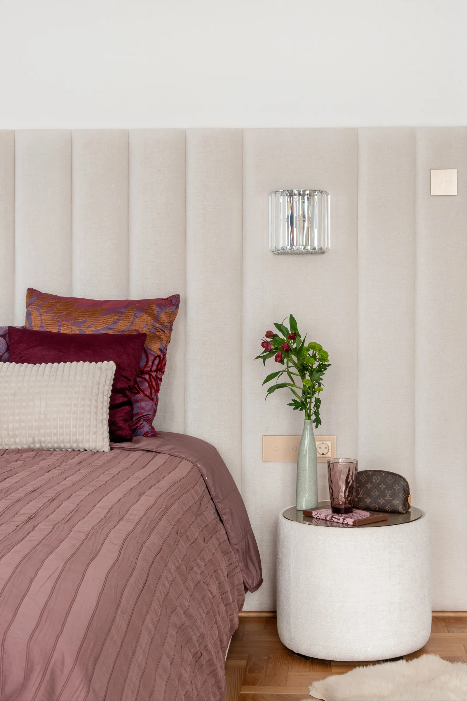 Velvet pouf and chandelier pendants