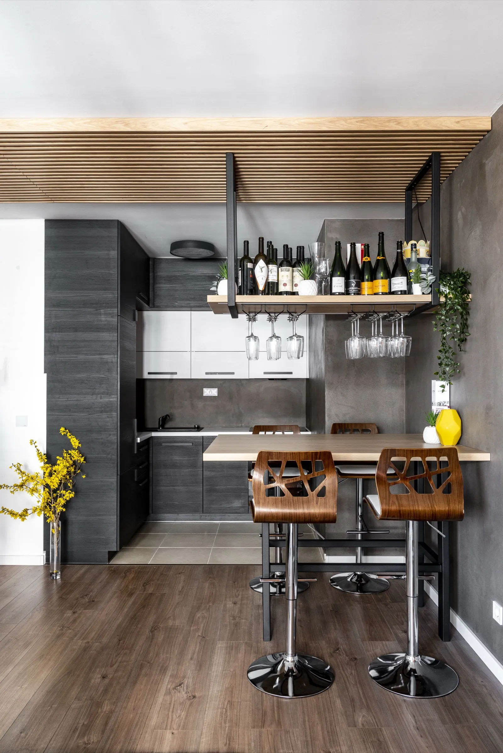 Ceiling slats descending onto the wall