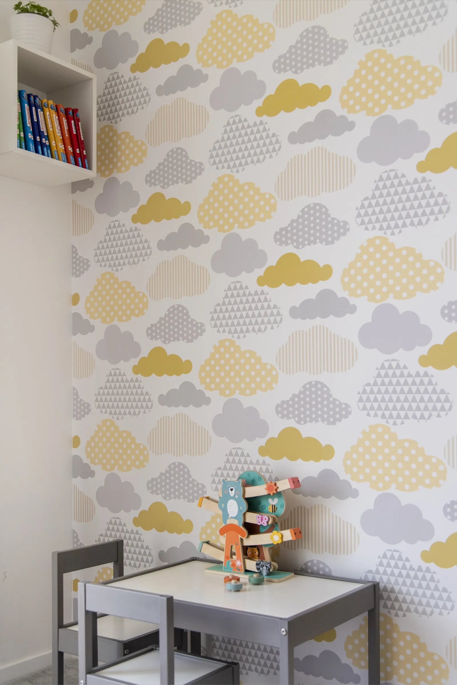 Living room with grey sofa and line art